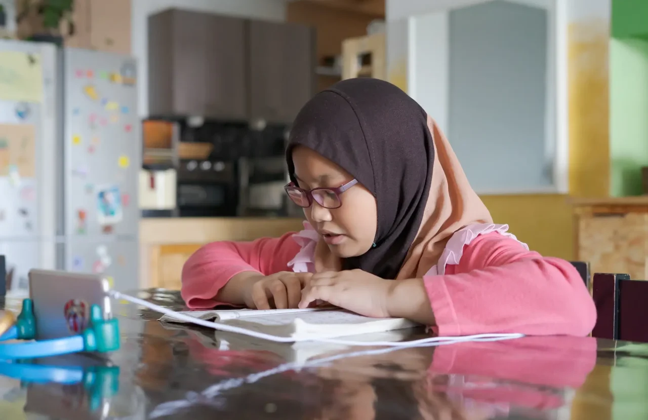 asian-kid-reading-al-quran-through-video-call-using-smartphone-during-education-and-learning
